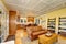 Cozy American sitting room with pastel yellow walls.