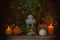 Cozy autumn background with pumpkins, rustic ceramics jugs