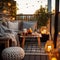 Cozy autumn balcony decor, warm fall city balcony decor with chair and pillows, pumpkins, yellow leaves and candles