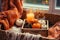 Cozy Autumn Vibes Pumpkins, Cones, and Candles on a Wooden Tray, Blurred Fall Mood Message on Lightbox, Warm Plaid on the