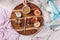 Cozy autumn or winter flatlay of wooden tray with cup of coffee, peaches, creamer with plant milk