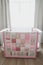Cozy baby cot with pink patchwork blanket. Baby bedding. Baby crib, close up. Textile for children nursery. Nap and sleep time