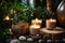 Cozy background. Scented candles surrounded by green plant leaves and stones