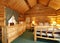 Cozy bedroom in log cabin house