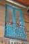 Cozy blue wooden balcony with a floral fence and wooden ceiling in Mercado Rosario in Argentina