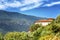 Cozy brick house in the mountains. Bright sunny day. Beautiful landscape