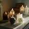 Cozy burning candles on white shelf. Concept of winter or autumn home interior decor