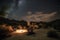 cozy campsite under starry night sky in desert