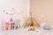 Cozy child room interior with play tent, table