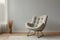Cozy corner Armchair by light grey wall indoors, text space