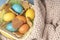 Cozy Easter background with colored eggs and homemade cookies