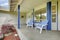 Cozy entrance porch with concrete floor and chairs.