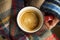 Cozy fall coffee cup top view, woman hands holding warm rustic autumn coffee cup