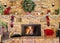 Cozy fire in brick fireplace and mantle decorated for Christmas