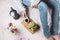 Cozy flatlay of woman in jeans and soft sweater sitting in her bed