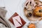 Cozy flatlay with wooden tray, cup of coffee or cocoa, candle, pumpkins, notebooks