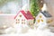Cozy house is wrapped in a hat and scarf in a snowstorm -window sill decor for Christmas, New Year. Winter, snow - home insulation
