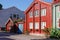 Cozy hugge atmospheric Scandinavian wooden multi-colored houses with a facade door. Fairy houses of Scandinavia