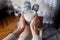 Cozy Indulgence: Woman\\\'s Hands Holding a Cup of Coffee with Milk Foam