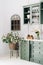 Cozy kitchen corner with green vintage furniture