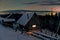 Cozy light in wooden cabin in winter