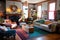 a cozy living room with a fireplace and comfy couches, surrounded by colorful and creative projects