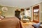 Cozy master bedroom with hardwood floor, and dark brown dresser.