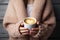 Cozy moment Woman holding a cup of warm, comforting coffee