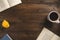 Cozy morning. Open books, rose, cup of coffee, on wooden background