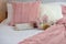 Cozy neutral decor guest bedroom with pink accents