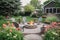 cozy outdoor patio with lounge chairs, fire pit, and blooming garden