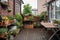 cozy outdoor patio with mini garden, filled with plants and flowers