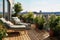 Cozy outdoor roof terrace with armchairs and potted plants