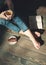 Cozy photo of young woman with cup of tea sitting on the floor