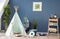 Cozy play tent for kids in interior of room