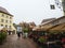 Cozy restaurants decorated with flowers and houses with colorful facades in the streets of Colmar