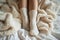 Cozy retreat legs in warm leggings and wool socks under blanket