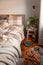 Cozy scandinavian bedroom interior in natural tones, real life mess disorder
