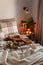 cozy scandinavian bedroom interior in natural tones, real life mess disorder