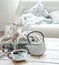 Cozy Scandinavian composition with teapot, ceramic cup of tea and decor details