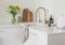 Cozy Scandinavian style kitchen interior - bouquet of hydrangeas and daisies vase, cutting boards, kettle, kitchen utensils on the