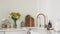 Cozy scandinavian style kitchen interior - bouquet of hydrangeas and daisies vase, cutting boards, kettle, kitchen utensils on the