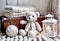 Cozy scenery with a white knitted teddy bear and white knit blankets