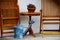 Cozy seating on the terrace with brown folding chairs and blue watering can