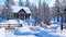 Cozy snowbound alpine mountain house at winter day
