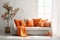 Cozy sofa with orange cushions near white wall with curtain against window