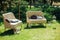 Cozy sofas for relaxing in the garden near the house on the grass. Relax and rest