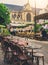 Cozy street with tables of cafe in Paris