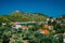 Cozy town, relaxing, summer feeling. Red roofs of Assos village at the lush green Mediterranean place of Kefalonia