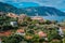 Cozy town, relaxing, summer feeling. Red roofs of Assos village at the lush green Mediterranean place of Kefalonia